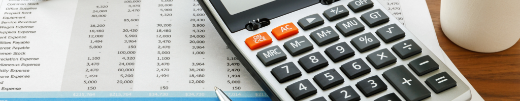 financial documents, calculator and glasses